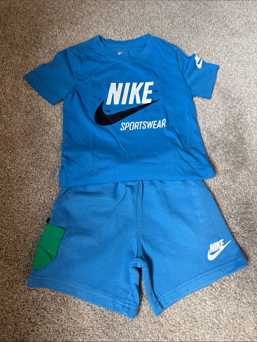 Nike Kids Blue Tee and Shorts Set with Green Pocket Accent